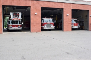 three fire trucks under the camp